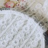 Synthetic lace with a decorative edge - widh 6,5 cm - white - 1 meter